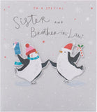 UKG Christmas greeting card featuring cute penguins ice skating, designed for sister and brother-in-law.