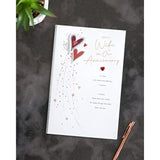 UKG wife anniversary greeting card with red hearts design and envelope, perfect for celebrating love and special occasions.