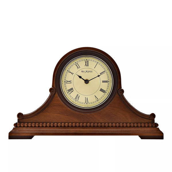 Wooden Napoleon mantel clock by Widdop & Co with classic design and detailed craftsmanship, shown on a mantel shelf.